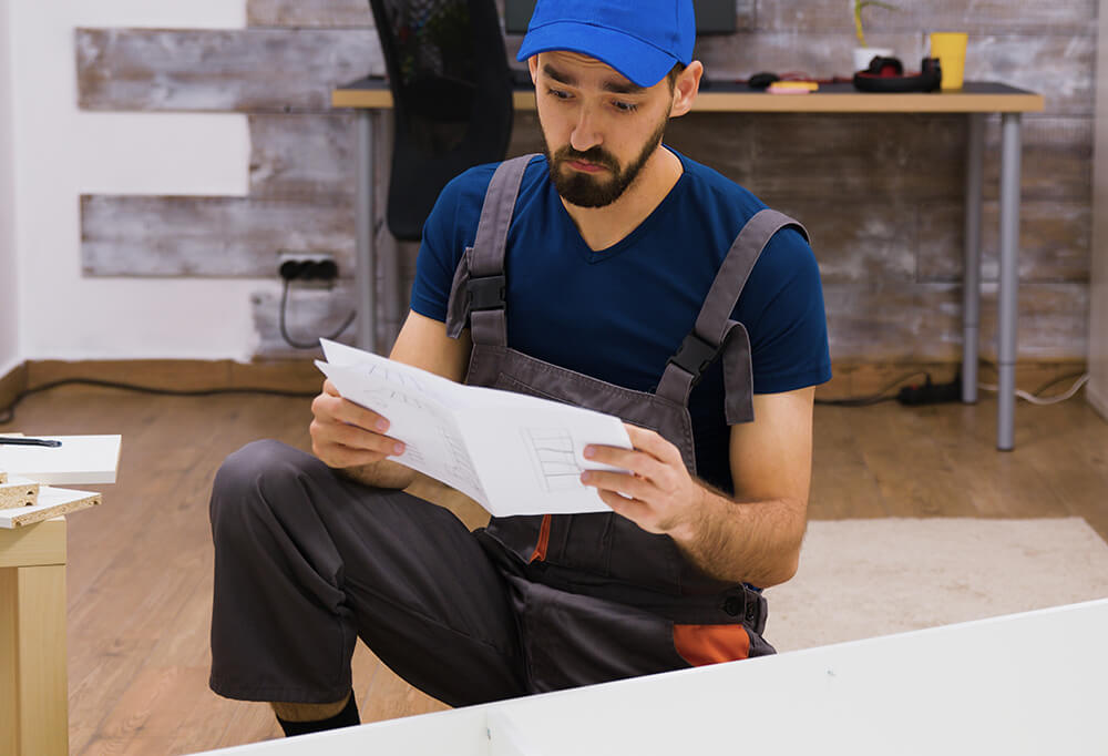 Confused Worker Overalls Reading Instructions Furniture Assembly Wearing Cap New Size Confused Worker Overalls Reading Instructions Furniture Assembly Wearing Cap New Size